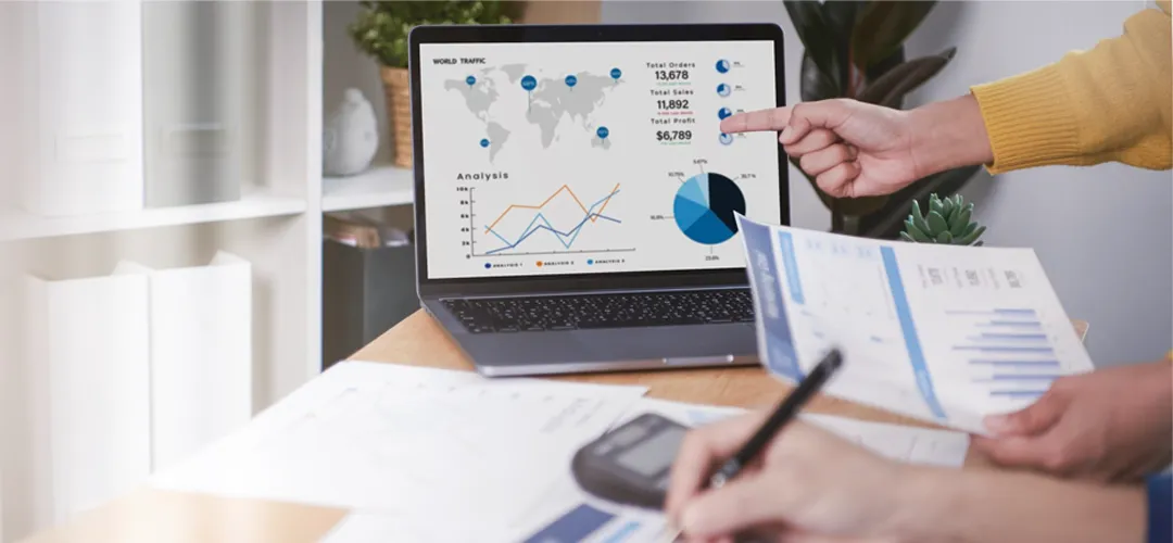 Real estate agent using Stimulus CRM on a laptop